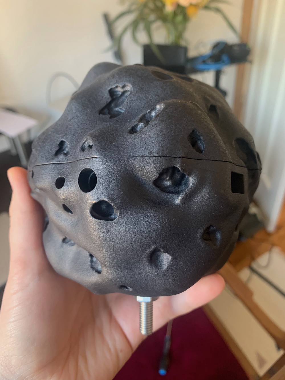 A diesel char Dustbox 2.0 with a bolt attached to the bottom