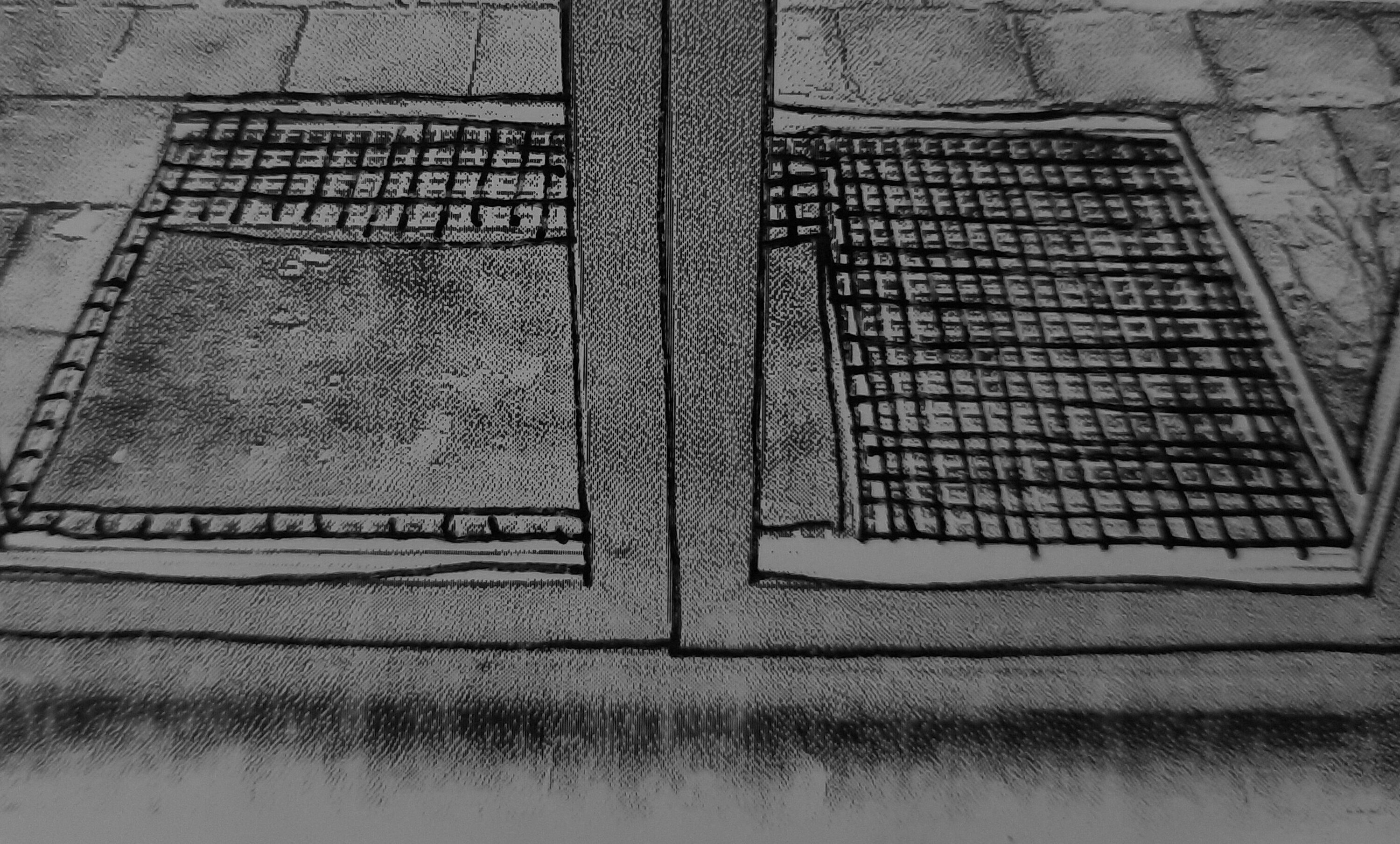 Looking through the glass door towards the garden showing the metal ramp that is placed outside, and the absence of a ramp inside